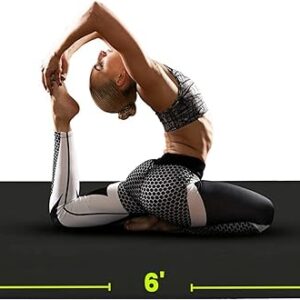 a woman stretches out on her gym floor mat