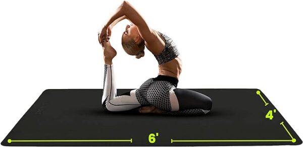 a woman stretches out on her gym floor mat